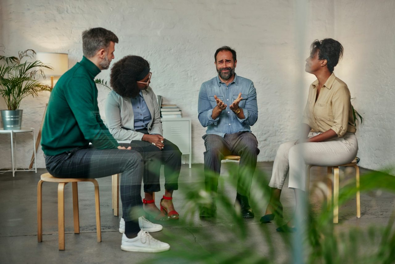 Man talking to the mental health support group